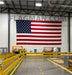 American flag in a warehouse for wall mounting with grommets along the edges.
