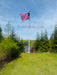 solar light on a fiberglass flagpole with an American Flag flying