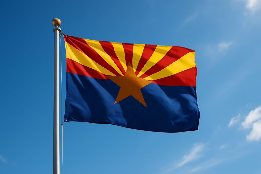 Realistic arizona flag flying on a flagpole with blue / sunny skies behind it