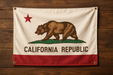 Realistic California flag with brass grommets in all 4 corners mounted to a wood wall
