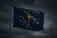 Realistic looking Indiana flag flying on a flagpole in rainy/windy conditions showing the flag material is strong while keeping the flag visible 