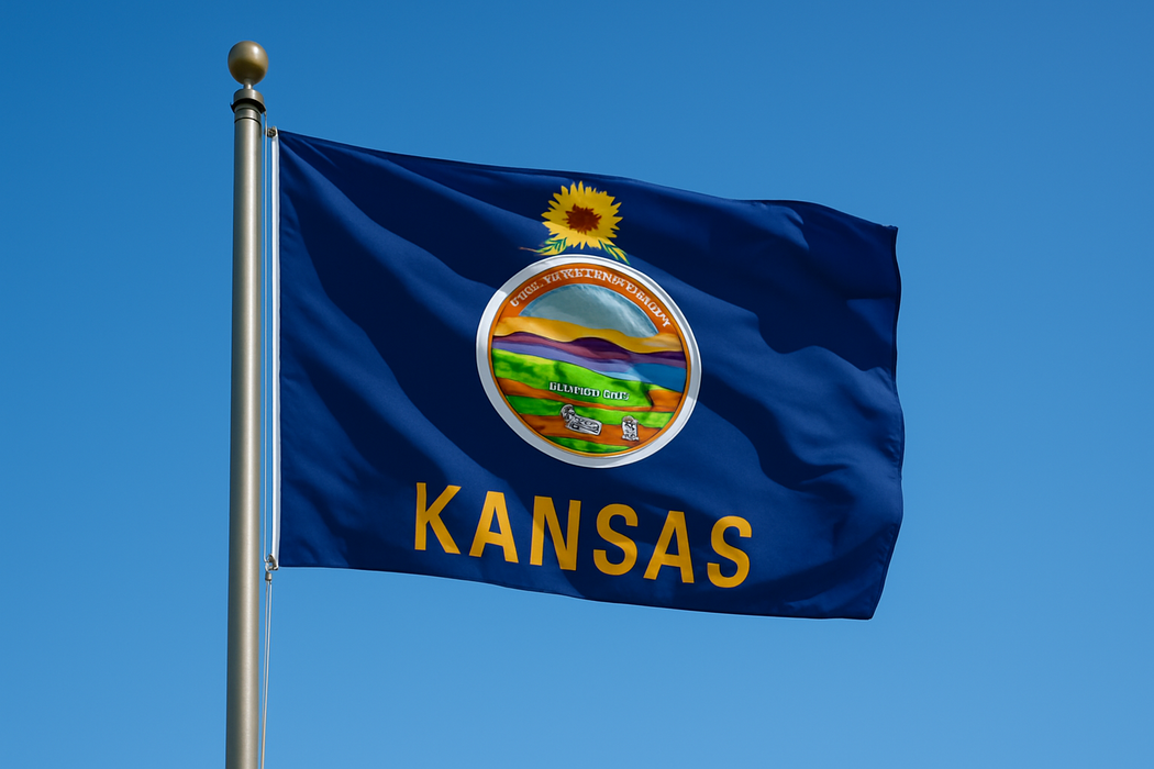 Realistic looking Kansas flag flying on a flagpole with clear blue sunny skies behind it