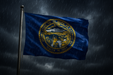 Realistic Nebraska flag flying on a flagpole in rainy/windy conditions shows the flag material is strong