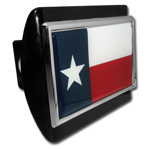A black all-metal hitch cover with a chrome-plated metal Texas flag emblem adhered to the front.
